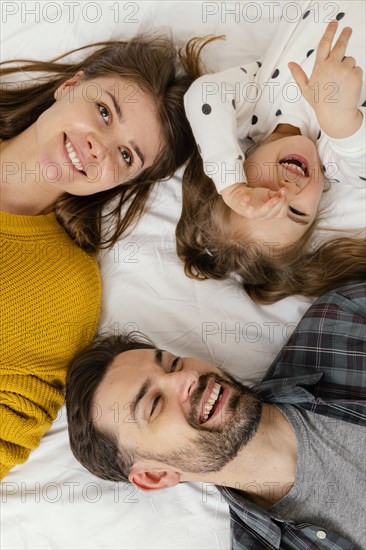 Close up smiley family bed