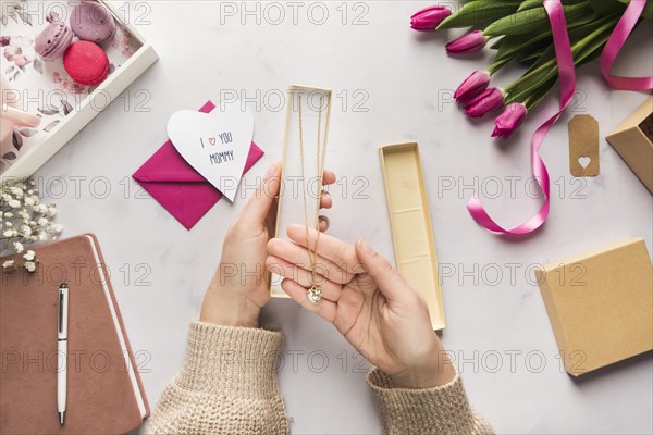 Hand holding beautiful necklace