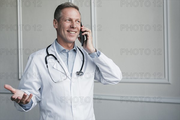 Doctor making phone call