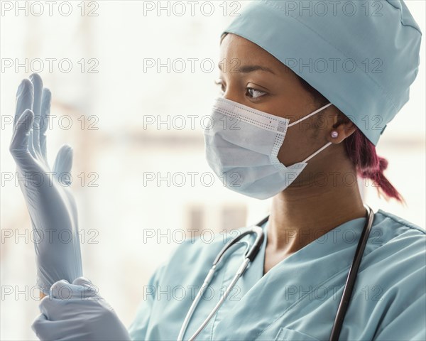 Close up health worker with gloves