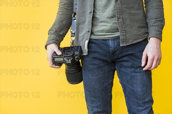 Grapher standing with camera