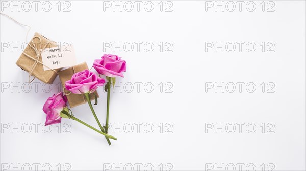 Roses with gifts happy mothers day inscription