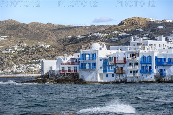 White Cycladic houses on the shore