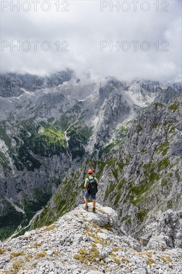 Mountaineer at the summit of the Waxenstein