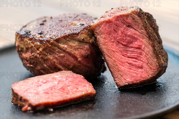 Closeup view of fillet mignon medium rare on a plate