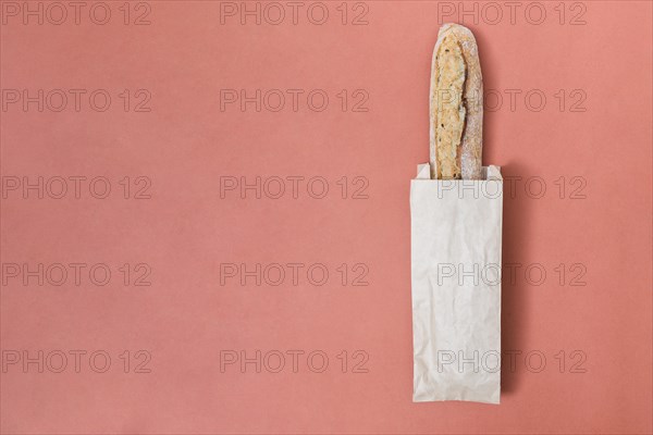 Baguette bread paper bag colored background