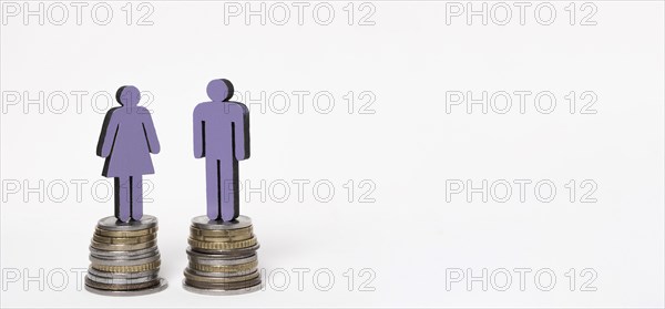 Man woman standing piles coins