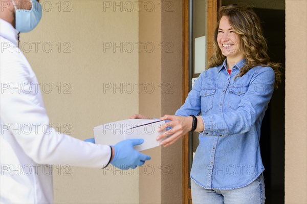 Beautiful woman receiving delivery