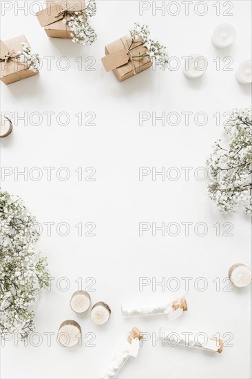 Gift boxes candles marshmallow test tubes baby s breath flowers white background