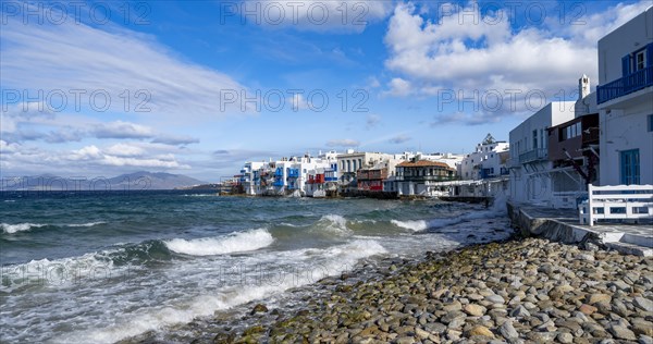 White Cycladic houses on the shore