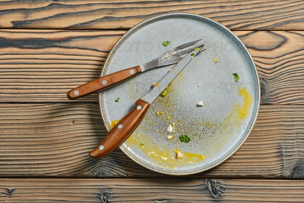 Top view of empty dirty plate on a table