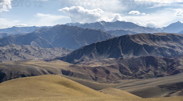 View over eroded mountainous landscape with brown dry hills
