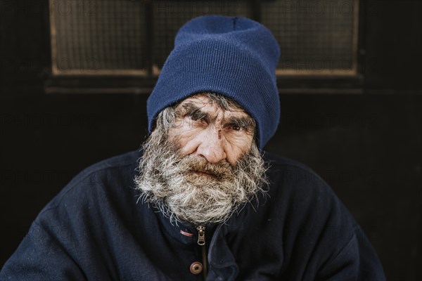Front view homeless man with beard