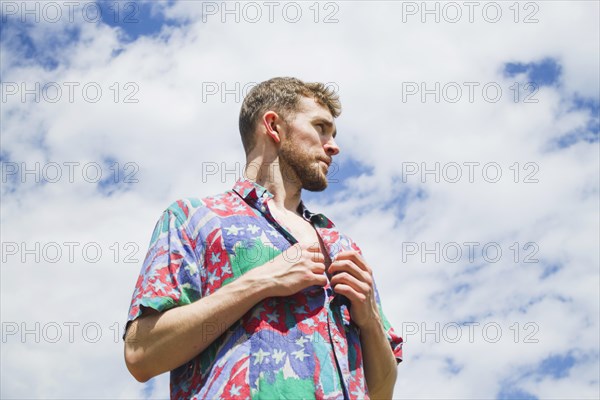 Low medium shot portrait stylish man looking away