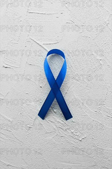 Blue ribbon plaster background