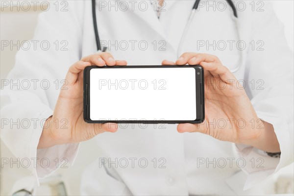 Close up doctor holding smartphone mock up