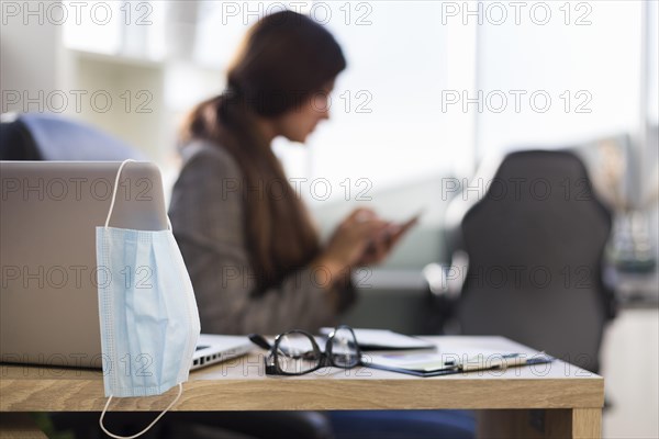 Side view defocused businesswoman woman desk