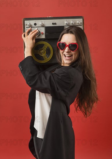 Woman party wearing sunglasses with radio