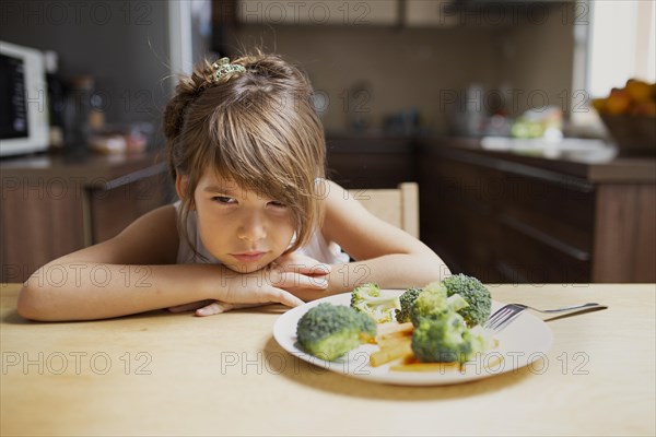 Front view picky girl refuse vegetables