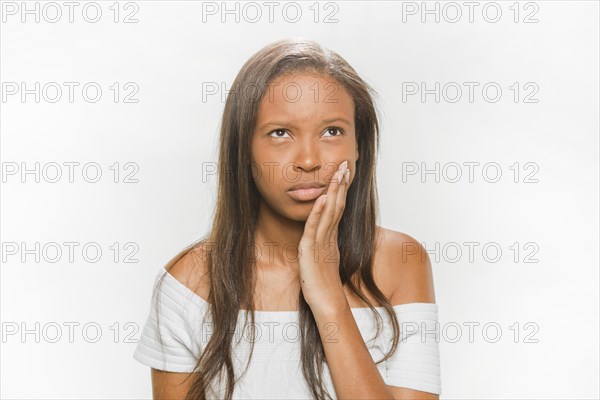 Portrait teenage girl suffering from tooth pain