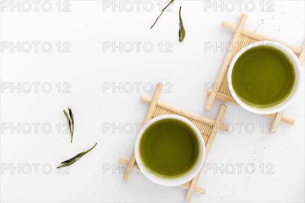 Top view ceramic cups with matcha tea