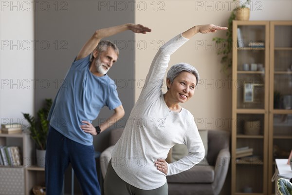 Senior couple exercising home