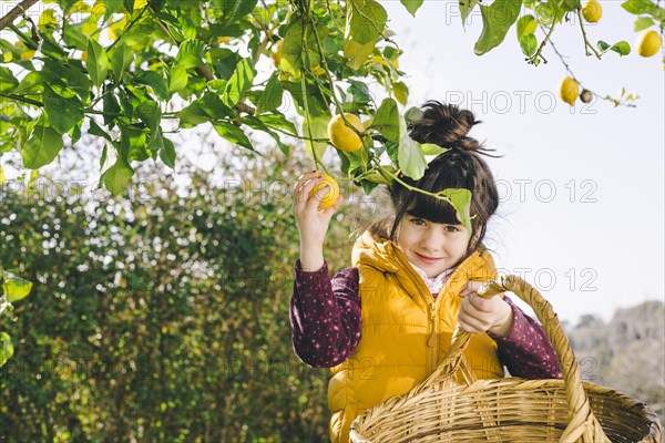 Girl with basket looking camera