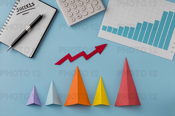 Top view business items with growth cones arrow