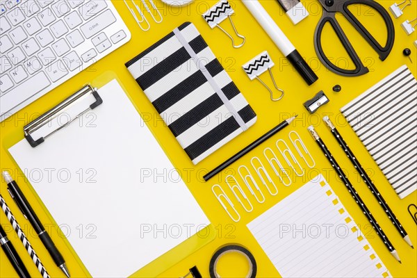 Flat lay office stationery with pencils keyboard