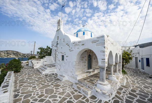 White Greek Orthodox Church Holy Church of Agios Konstantinos with Greek flag