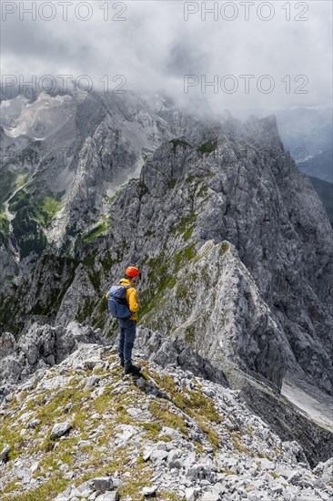 Mountaineer at the summit of the Waxenstein