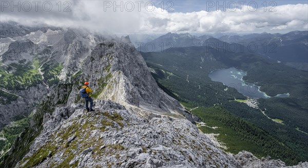 Mountaineer at the summit of the Waxenstein