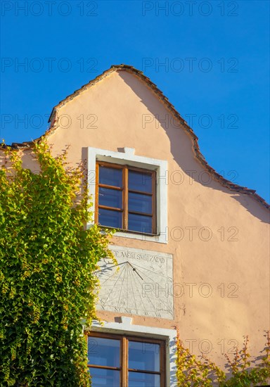 Sundial on a house facade in the historic old town of Ceske Budejovice