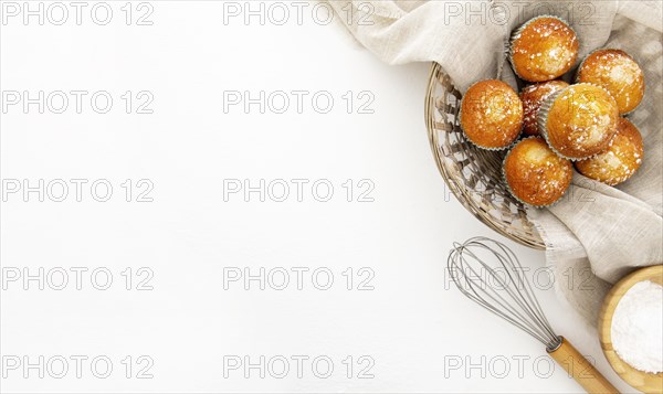 Basket filled with cupcakes copy space
