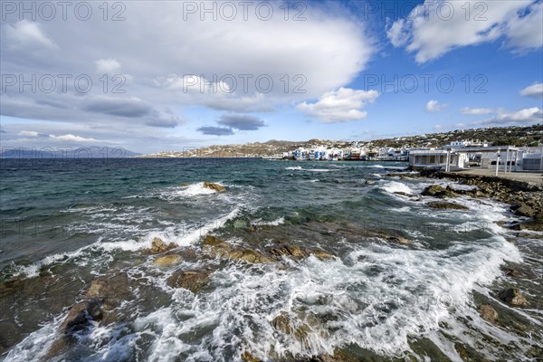 Waves breaking between the rocks on the beach