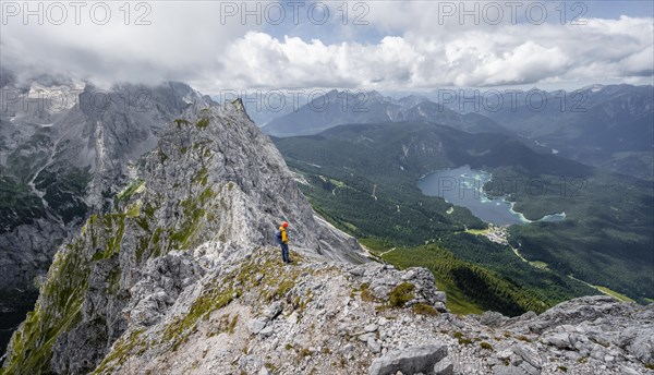 Mountaineer at the summit of the Waxenstein