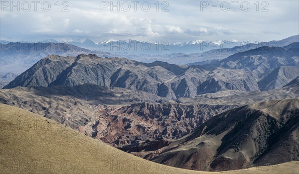 View over eroded mountainous landscape of Konorchek Canyon with red sandstone rocks