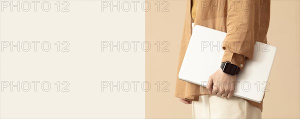 Person holding laptop protective case copy space