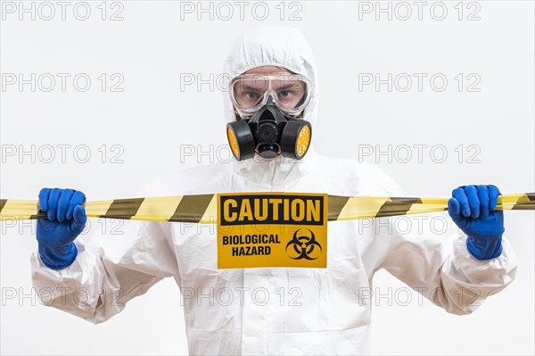 Man hazmat suit with danger sign