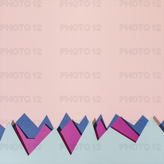 Top view colorful paper pink background