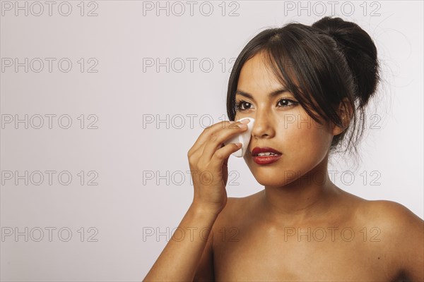 Modern woman with cotton pad