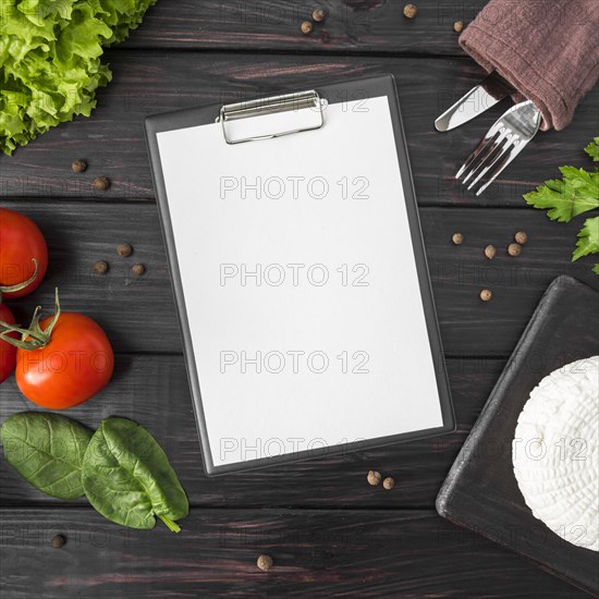 Top view empty menu with tomatoes spinach