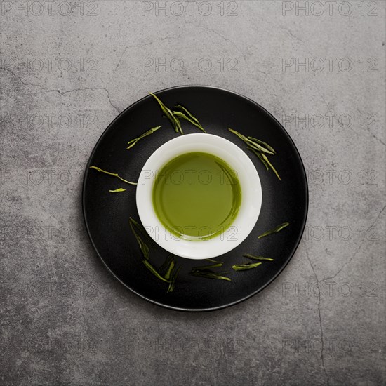 Top view cup matcha tea plate