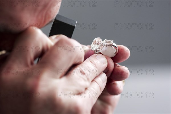 Checking a ring with a gemstone for authenticity