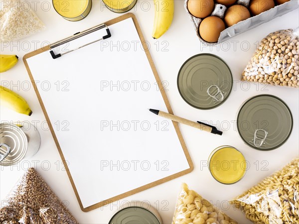 Flat lay fresh provisions donation with notepad