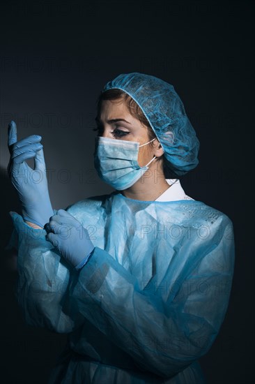 Surgeon posing darkness