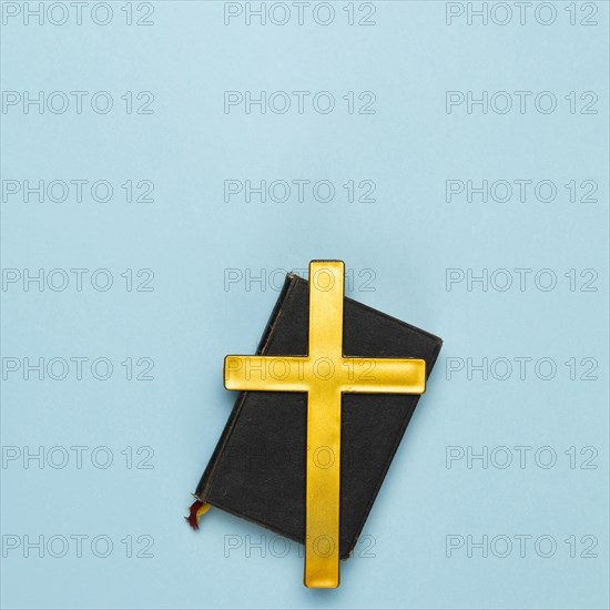 Top view holy bible with wooden cross