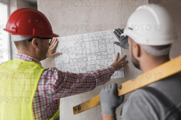 Close up men looking plan