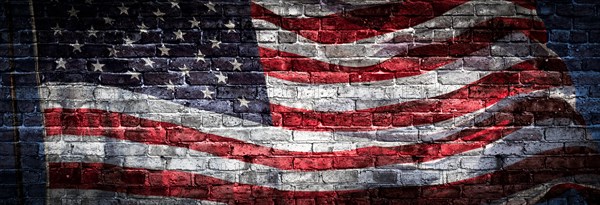 American flag over rough brick wall background banner