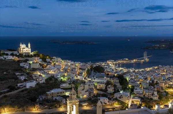 View of the illuminated town of Ermoupoli with Anastasi Church or Church of the Resurrection